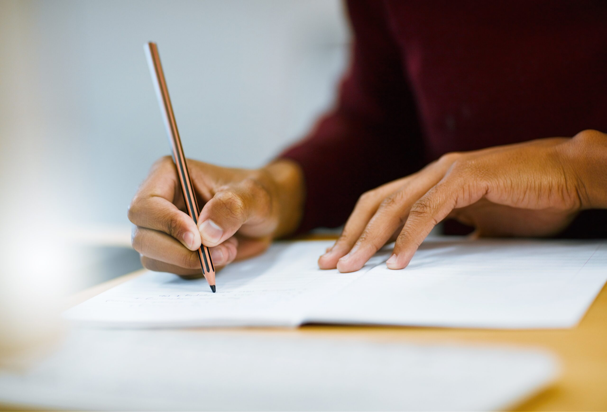 Writing,,Notebook,And,Hands,Of,Person,In,Library,For,University Psychoeducational Assessment